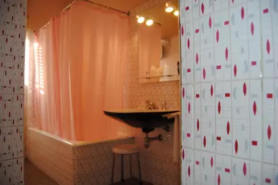 a bathroom with a sink and a bath tub and a sink at Hotel Miradouro in Porto