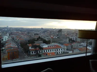 a view of a city from a window at Hotel Miradouro in Porto