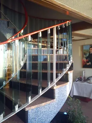 a glass staircase in a restaurant with a table at Hotel Miradouro in Porto