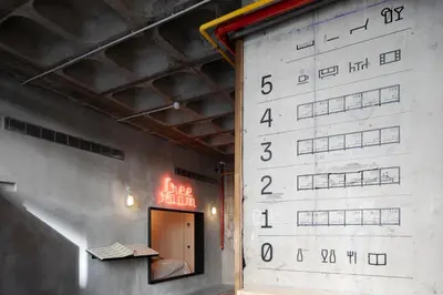 a wall with a large wall with numbers on it at Zero Box Lodge Porto in Porto