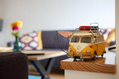a toy van with luggage on top of it on a table at LovelyStay - Oren Duke's House in Porto