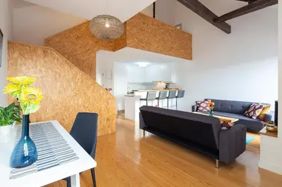 a living room with a couch and a table at LovelyStay - Oren Duke's House in Porto