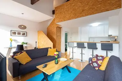 a living room with a couch and a table at LovelyStay - Oren Duke's House in Porto