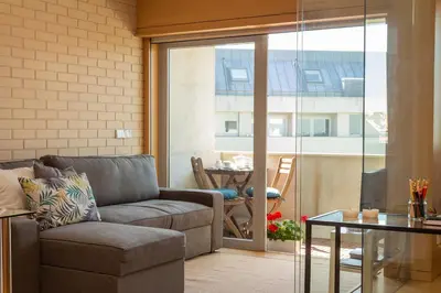 a living room with a couch and a table at Portus Vita Apartamento T0 Duplex in Vila Nova de Gaia