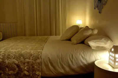a bedroom with a bed with pillows on it at Casa Braancamp II - Chic & Sweet in Porto