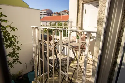 a staircase with a picture of a bridge on the wall at Guest H4U - Bonjardim Terrasse Center in Porto