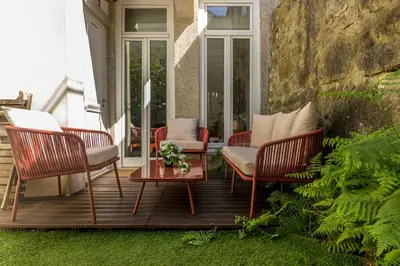a large white bed in a room with a window at Guest H4U - Bonjardim Terrasse Center in Porto