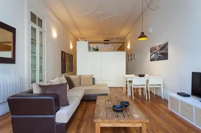 a living room with a couch and a table at Loft Ribeira - 3px - Spacious Flat in Porto