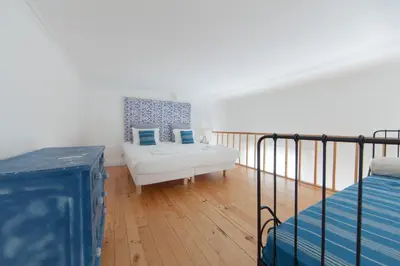 a bedroom with a bed and a couch in a room at Citybreak-apartments Patio in Porto