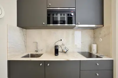 a kitchen with a sink and a microwave at YOUROPO - Market in Porto
