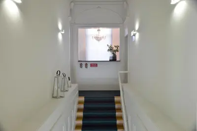 a hallway with a staircase with a window at YOUROPO - Market in Porto