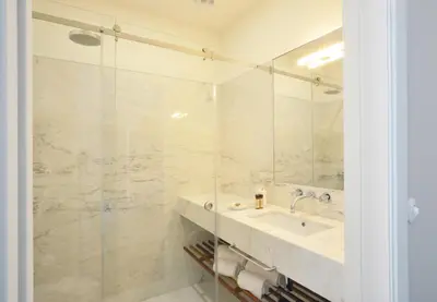 a bathroom with a sink and a shower at YOUROPO - Market in Porto