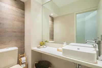 a bathroom with a sink and a mirror at Oportments - Oliveiras in Porto