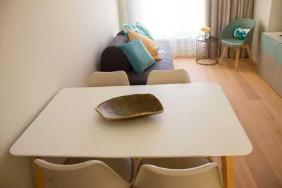 a white table with a hat on top of it at MH Duo in Porto