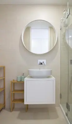 a bathroom with a white sink and a mirror at MH Duo in Porto