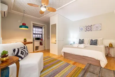 a bedroom with a bed and a couch at Best Of Porto Apartment - BOP in Porto