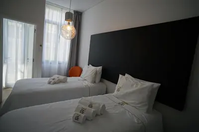 a kitchen with a washing machine and a microwave at Stylish house - air cond, breakfast, free parking, by Porto with Love LDA in Vila Nova de Gaia