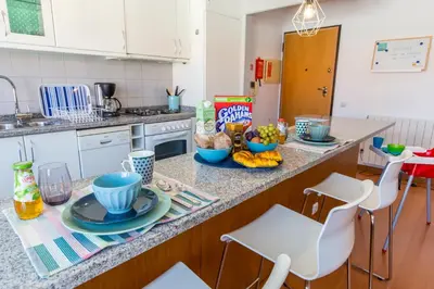 a kitchen with a counter with food on it at Sunset Relaxing Apt with terrace, parking & bikes in Porto
