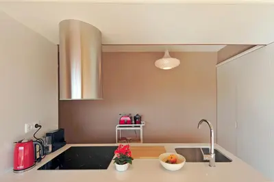 a kitchen with a sink and a counter top at Oporto AAA - Almada Aliados Apartment in Porto