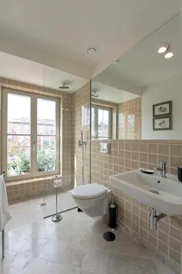 a bathroom with a toilet and a sink at Oporto AAA - Almada Aliados Apartment in Porto