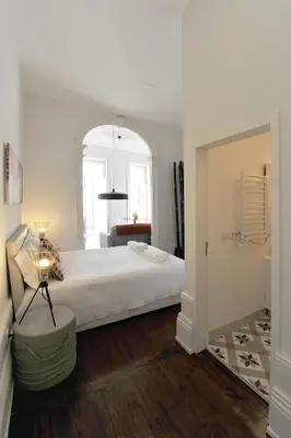 a bedroom with a large white bed in a room at FLH Porto Elegant Flat with Terrace in Porto