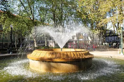a water fountain in the middle of a park at FLH Porto Elegant Flat with Terrace in Porto