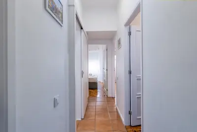 a hallway with white walls and a tile floor at OPO Bolhao Flats by Destiny Houses in Porto