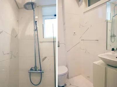 a bathroom with a shower and a toilet and a sink at OPO Bolhao Flats by Destiny Houses in Porto