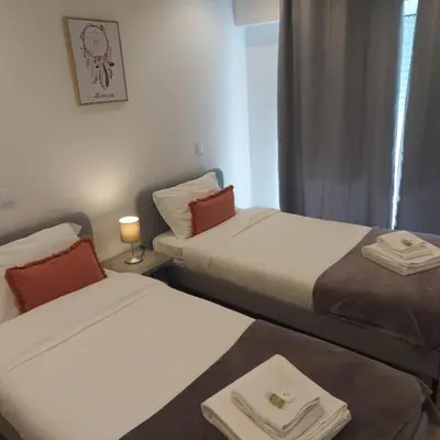 two beds in a small room with a window at OPO Bolhao Flats by Destiny Houses in Porto