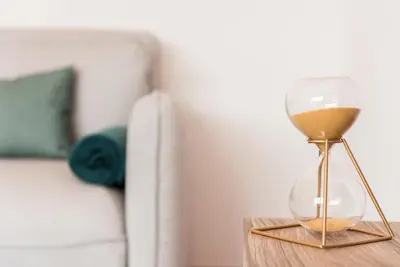 a hourglass sitting on a table next to a couch at GuestReady - Jazz Apartment in Porto