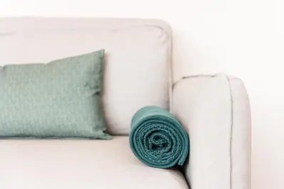 a green pillow sitting on top of a couch at GuestReady - Jazz Apartment in Porto