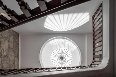 a room with a circular window and a ceiling at Caléway Hotel in Vila Nova de Gaia