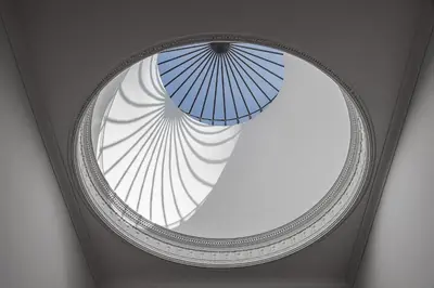 a round window with an umbrella in a ceiling at Caléway Hotel in Vila Nova de Gaia