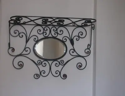 a mirror on a wall with a white wall at Hotel Chique Aliados in Porto