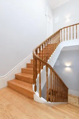 a staircase in a home with wooden floors at Skylight Apartment in Porto