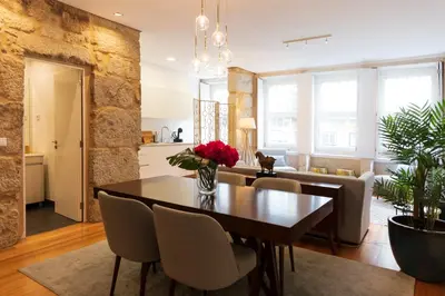 a dining room with a table and chairs at Aposentus - Your fabulous home next to Ribeira in Porto