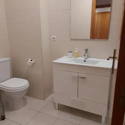 a shower with a glass door in a bathroom at Apartamento Praça - Vistas sobre a cidade in Porto