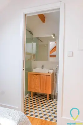 a bathroom with a sink and a mirror at Loft Almada in Porto