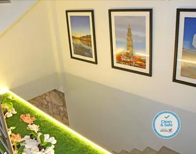 a stairway with pictures of the eiffel tower at Vivacity Porto - Rooms & Apartments in Porto