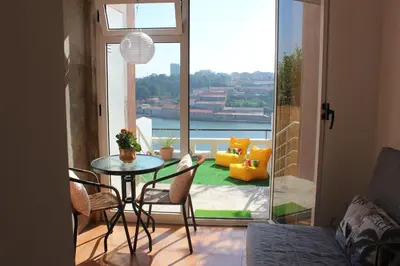 a staircase with wooden railings in a home at Oportobestview-River in Porto