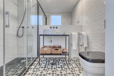 a bathroom with a shower and a toilet and a sink at Formosa Apartment with Free Parking and Historic Charm! in Porto