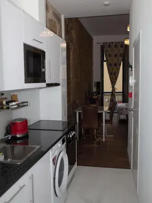 a kitchen with a sink and a stove top oven at Central Cozy Star 1 Balcony AC Near Merto in Porto