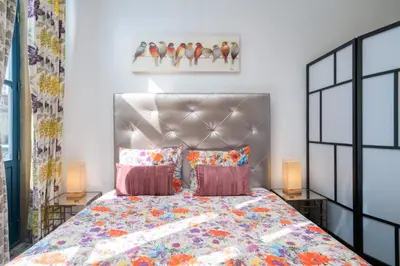 a bedroom with a bed and two lamps at Central Cozy Star 1 Balcony AC Near Merto in Porto