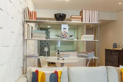 a living room with a couch and a table at Go2oporto @Ceuta in Porto