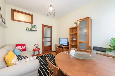 a living room with a table and a couch at GuestReady - Sweet & Relax Flat in Porto