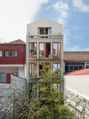 an apartment building with balconies on the side of it at Hotel Tipografia do Conto by Casa do Conto in Porto