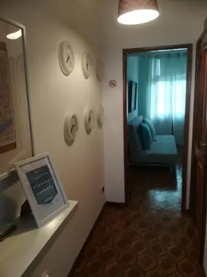 a room with a mirror and a room with a chair at Oportobestview in Porto