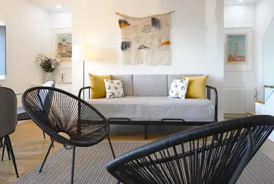 a living room with a couch and two chairs at HM - OPorto City View in Porto