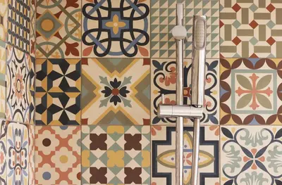 a bathroom with colorful tiles on the wall at HM - OPorto City View in Porto
