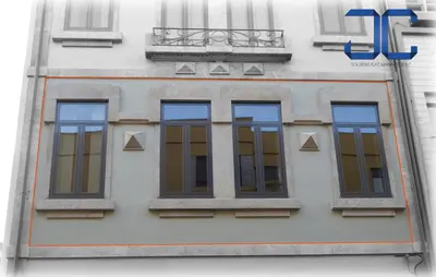 a building with four windows on the side of it at Click! Apartment by JC in Porto
